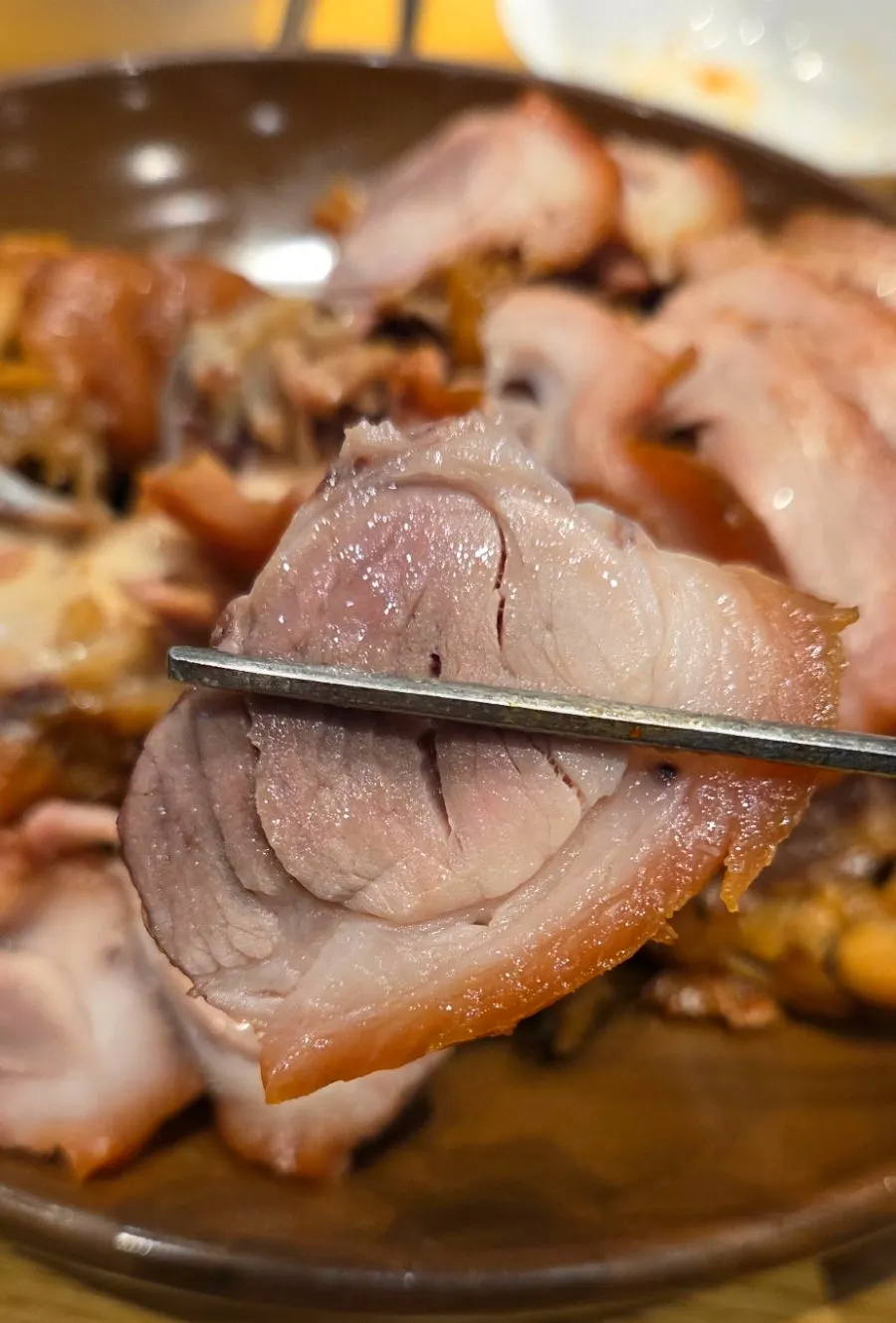 Tender meat and skin visible on a piece of jokbal