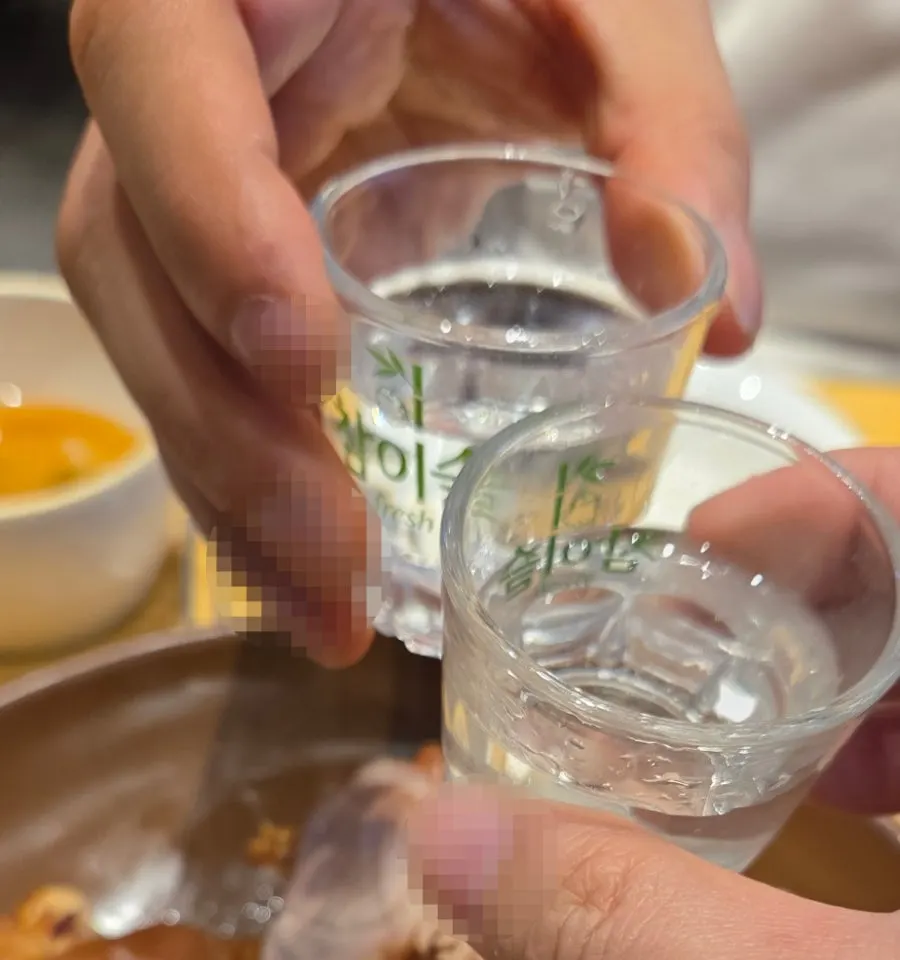 Jokbal served alongside a glass of soju
