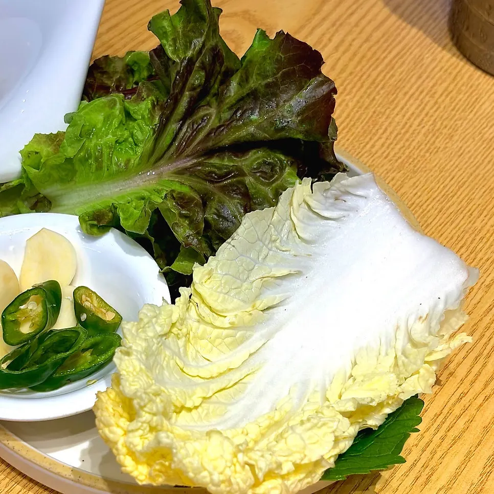 Basic table setting with lettuce wraps, salted shrimp and ssamjang