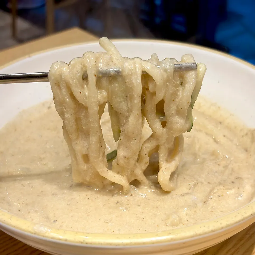 A bowl of perilla kalguksu with rich broth