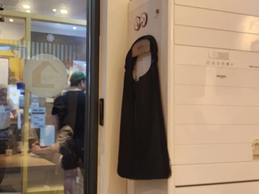 Aprons set out for customers at one side of the restaurant