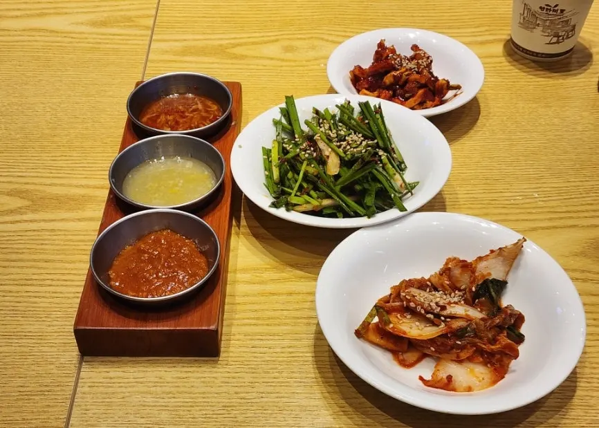 Three basic banchan: chive muchim, persimmon kimchi, dried radish strips