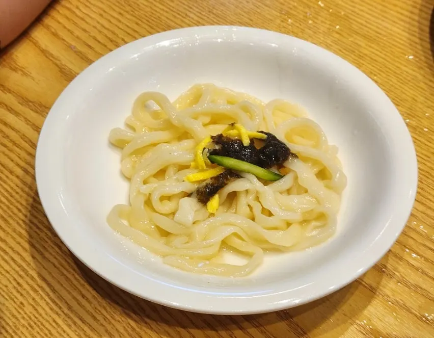 Kalguksu broth and noodles with zucchini