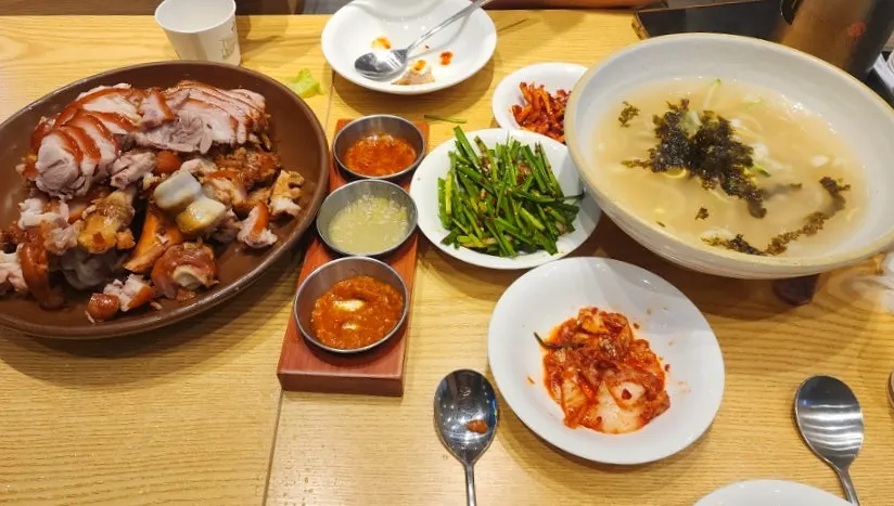 A table spread with house-made kimchi sides