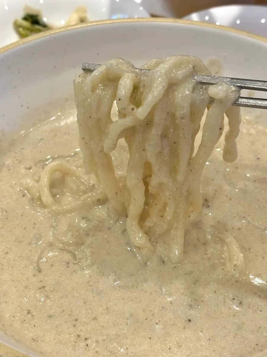Close-up of perilla kalguksu noodles