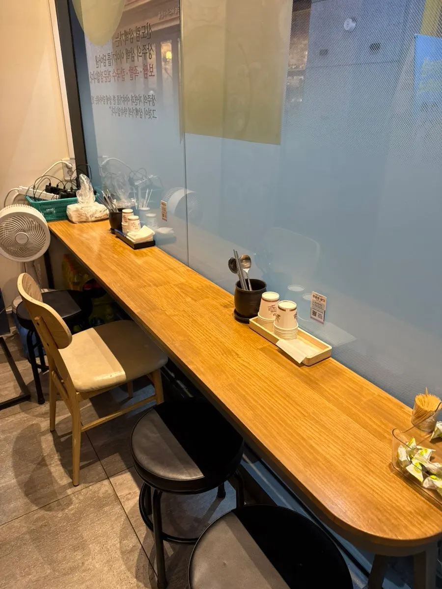 Bar seating for solo diners at Sambaekga