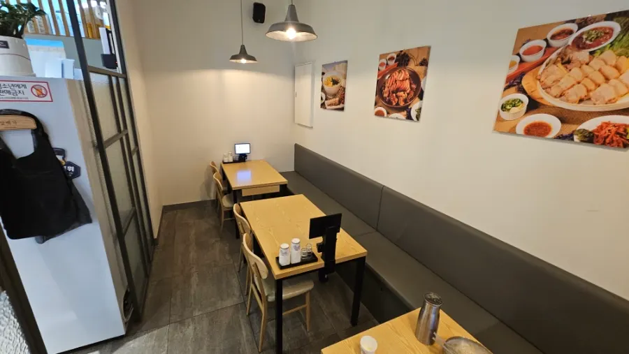 Interior with 4-person tables further inside the restaurant