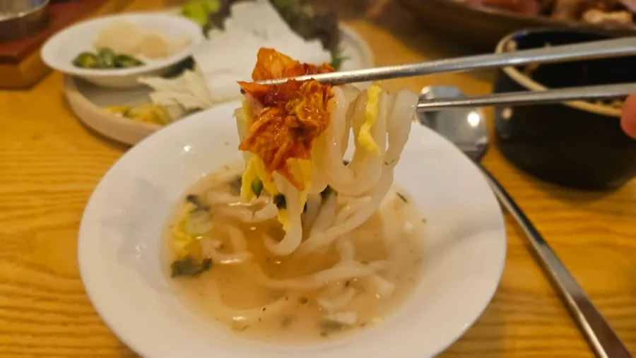 Fresh kalguksu noodles lifted from the bowl