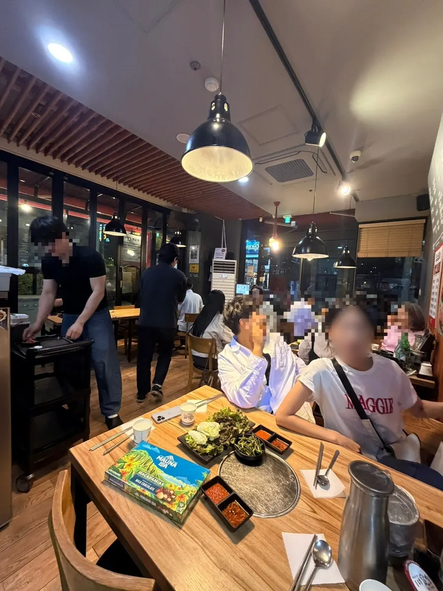 Tables full of customers at the jokbal restaurant