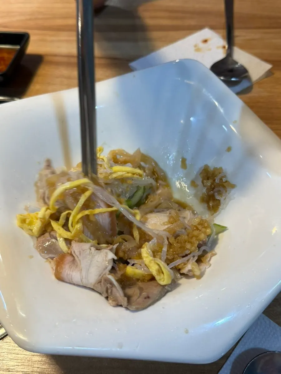 Picking up a piece of cold jokbal salad