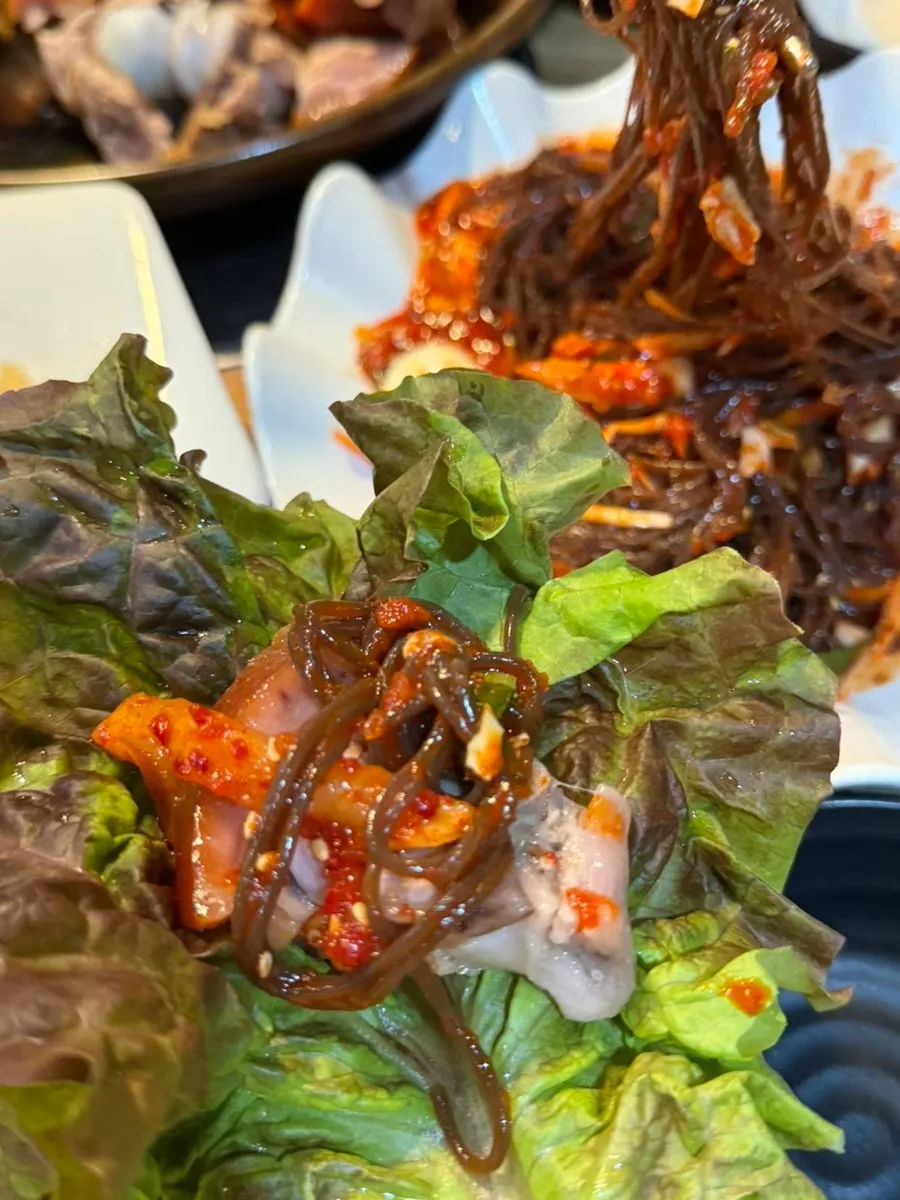 Plate with makguksu and jokbal served together