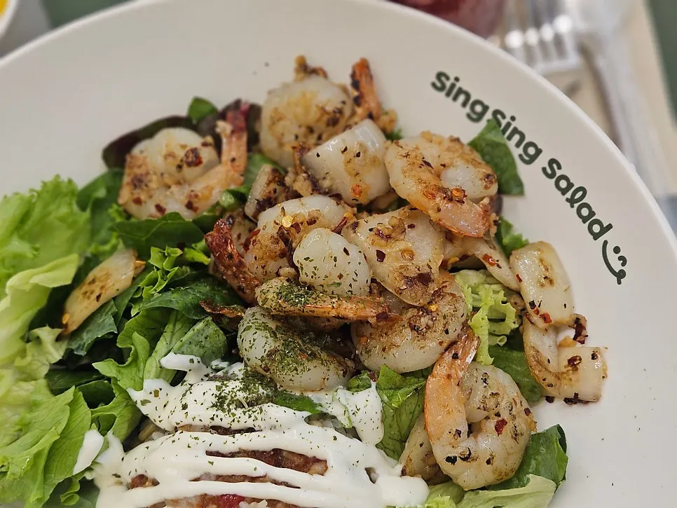 Full view of garlic shrimp poke topped with shrimp