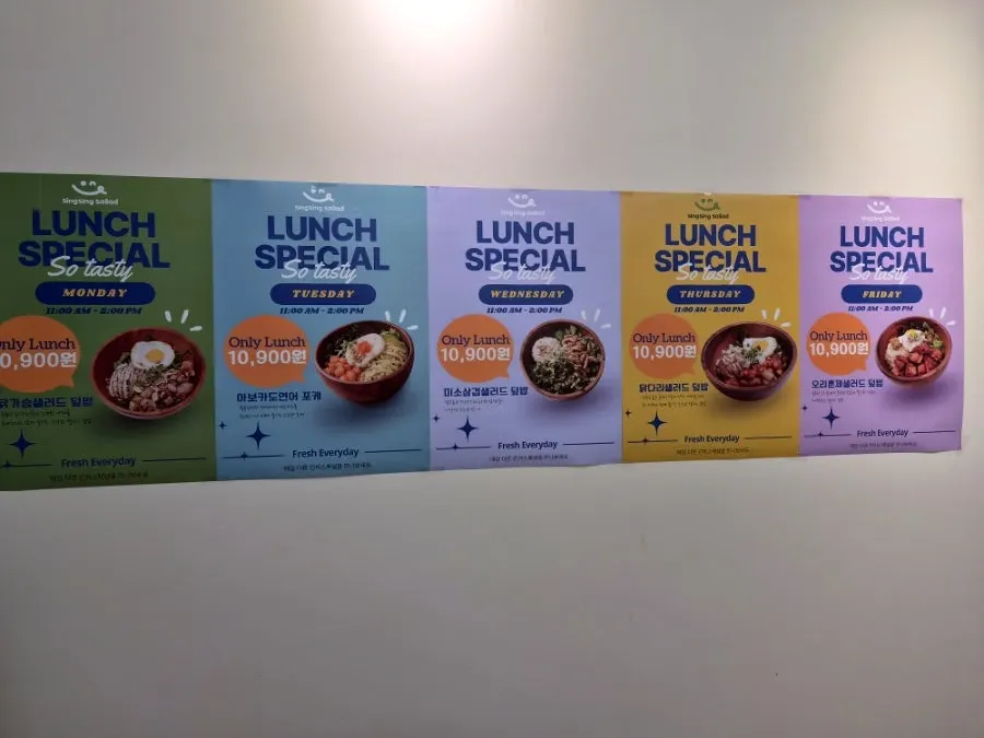 Store interior with day-of-week lunch special menu signage