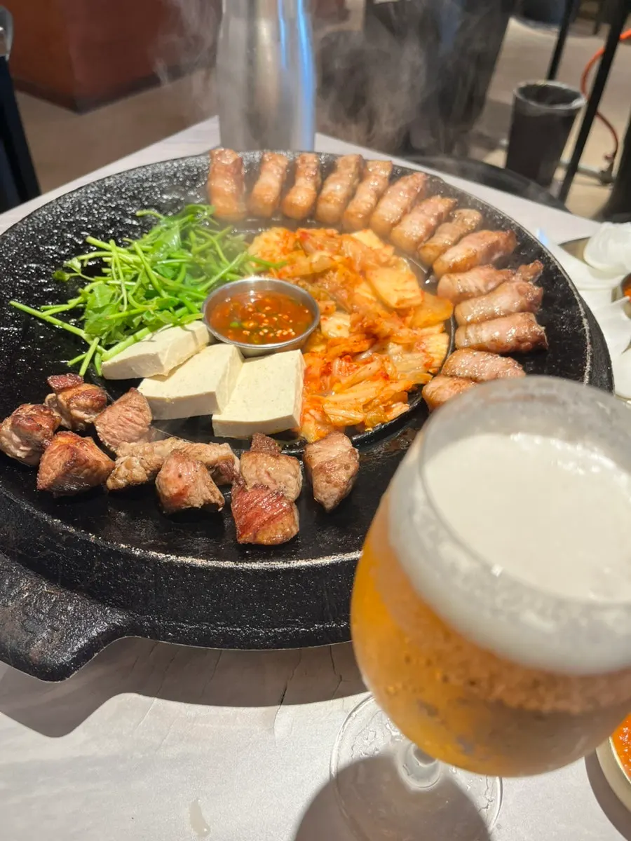 Pork belly with minari, kimchi, and tofu