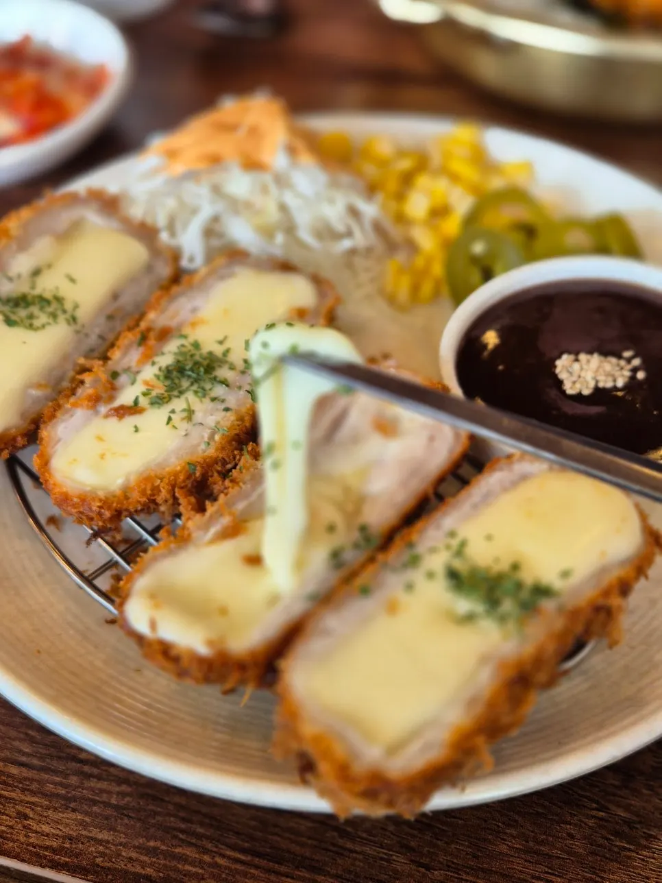 Cross-section of cheese donkatsu with stretching cheese