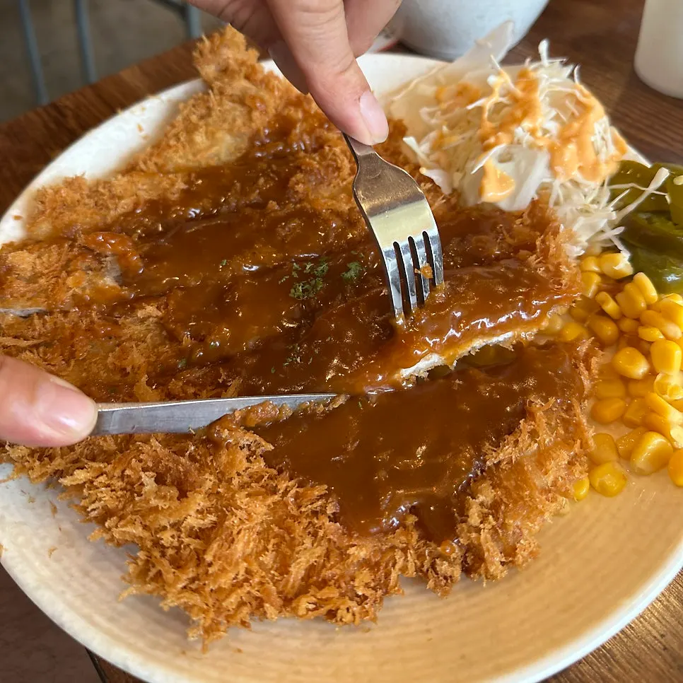 Old-school pork cutlet covering a wide plate