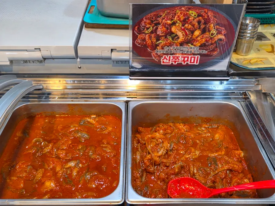 Refilled thin-sliced pork belly and regular pork belly on the buffet