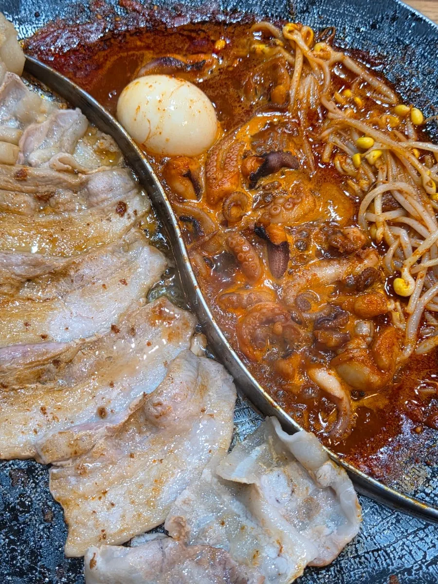 Pork belly and thin-sliced pork belly cooking on the grill