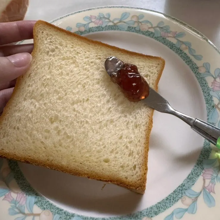 Golden Beurre milk bread spread with jam