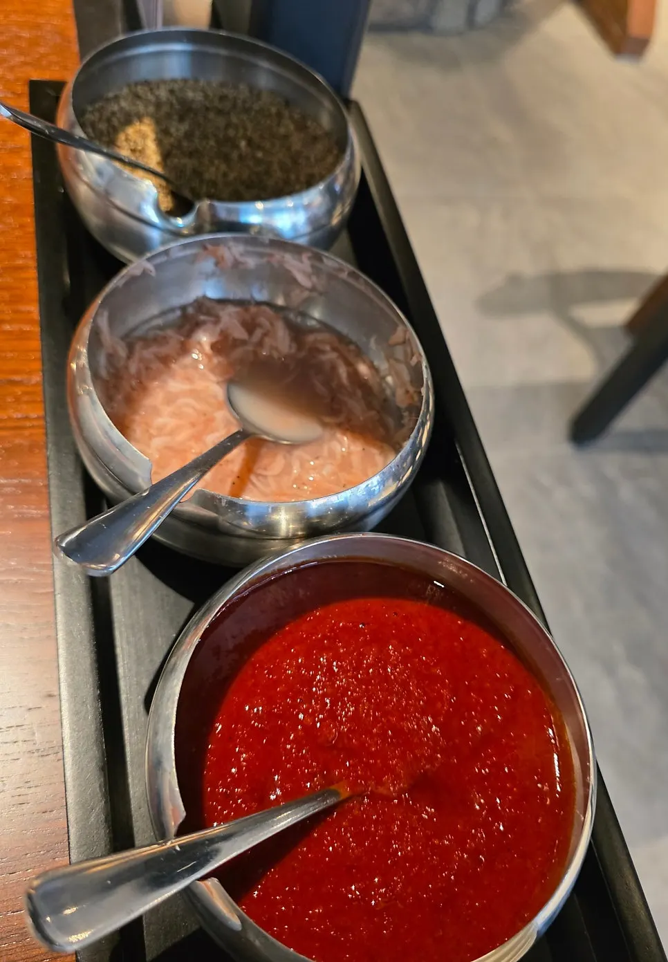 Bowls of chili paste, salted shrimp, and perilla powder seasonings