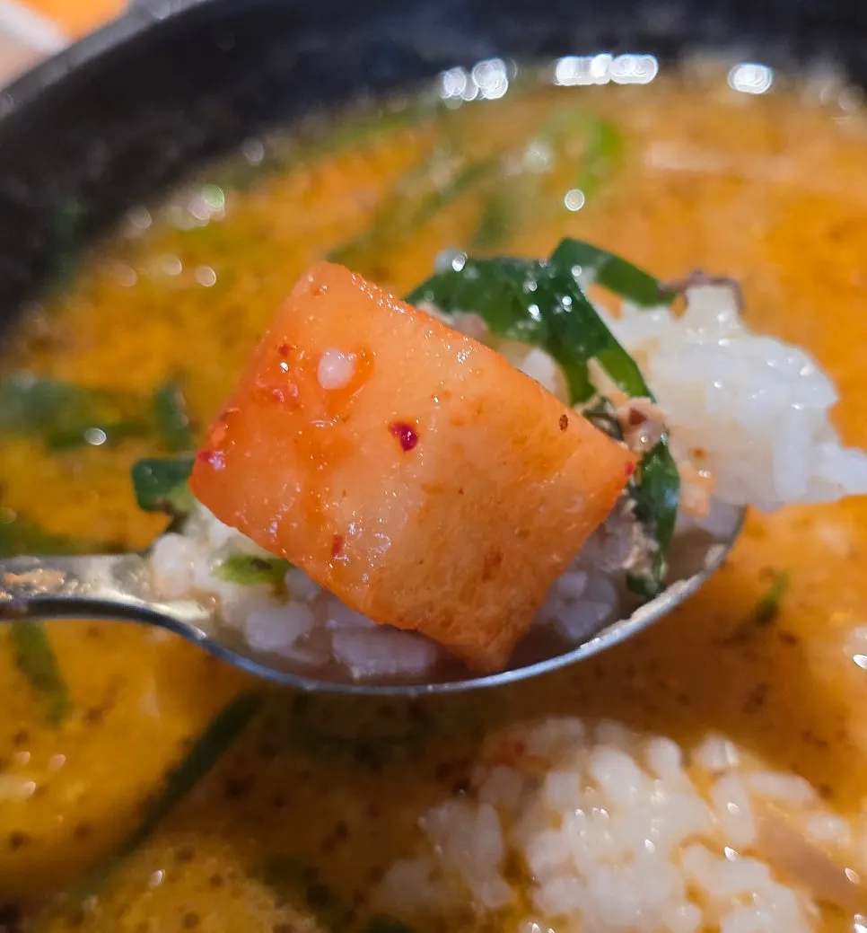 Sundae being eaten with salted shrimp on the side