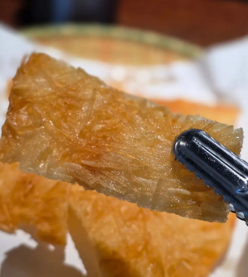 Crisp surface of the julienned potato pancake
