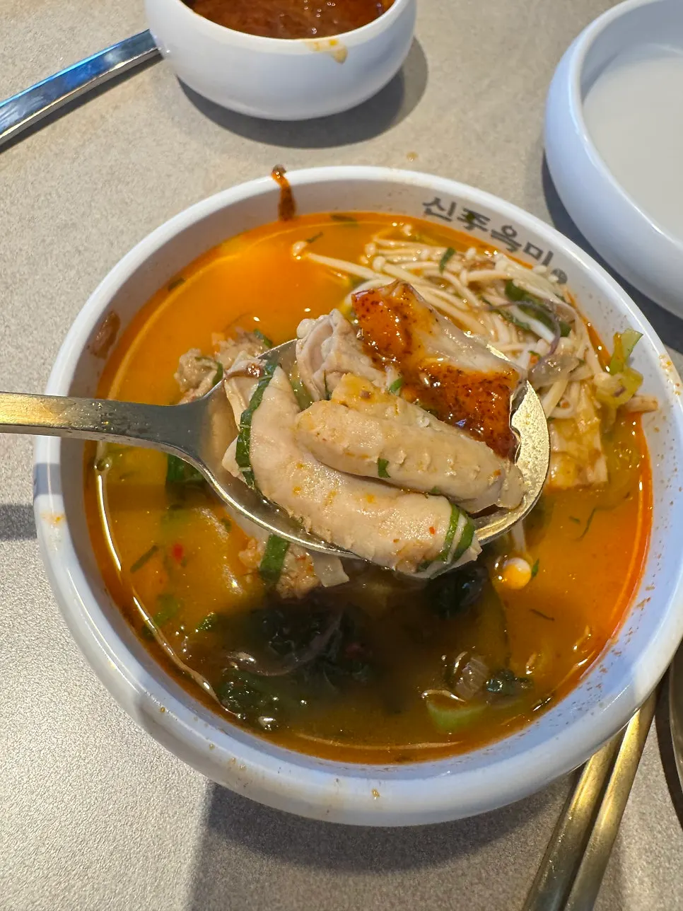 Close-up of sundae-gopchang jeongol piled high with fern