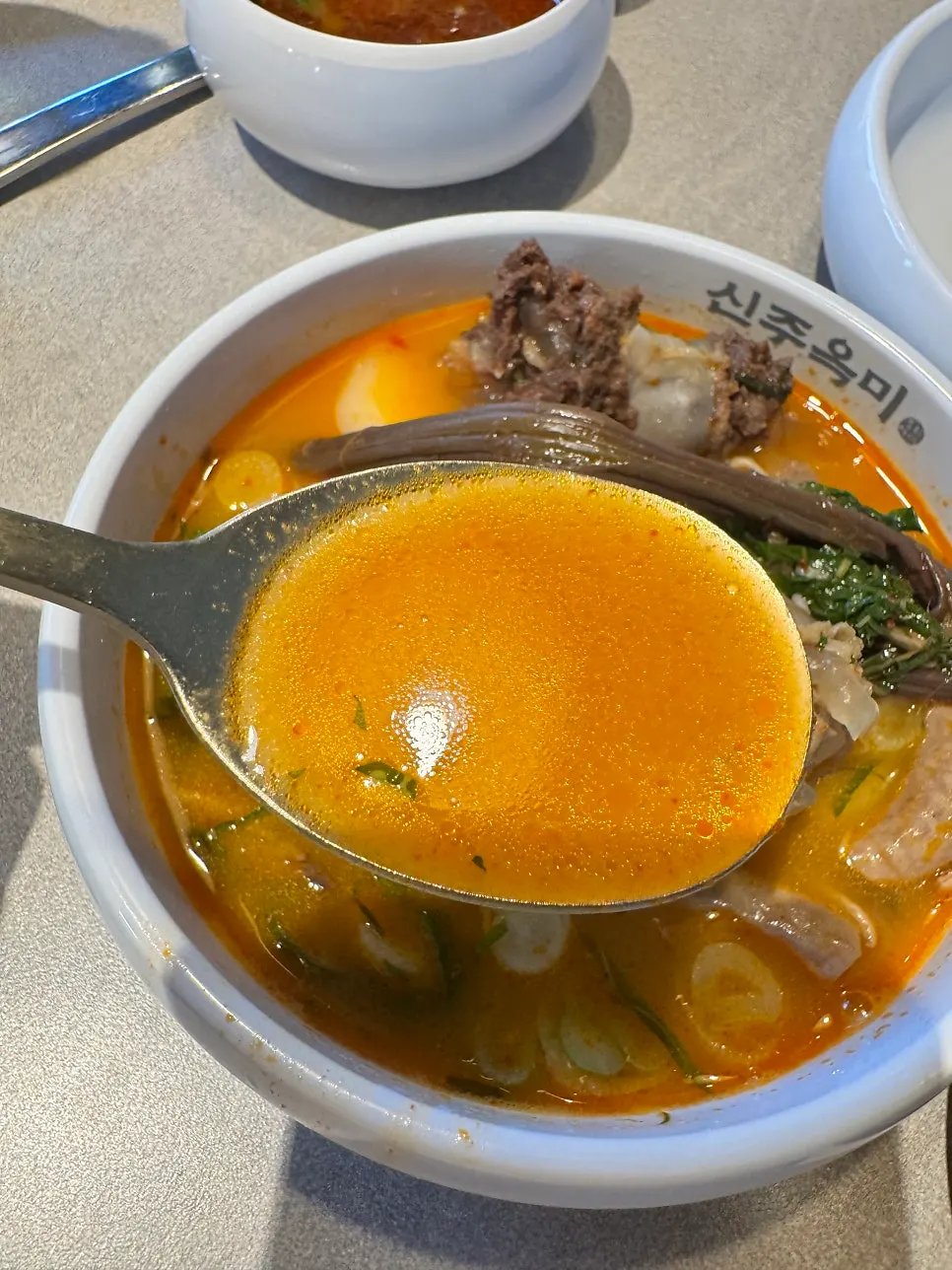 Chewy gopchang lifted out of the broth