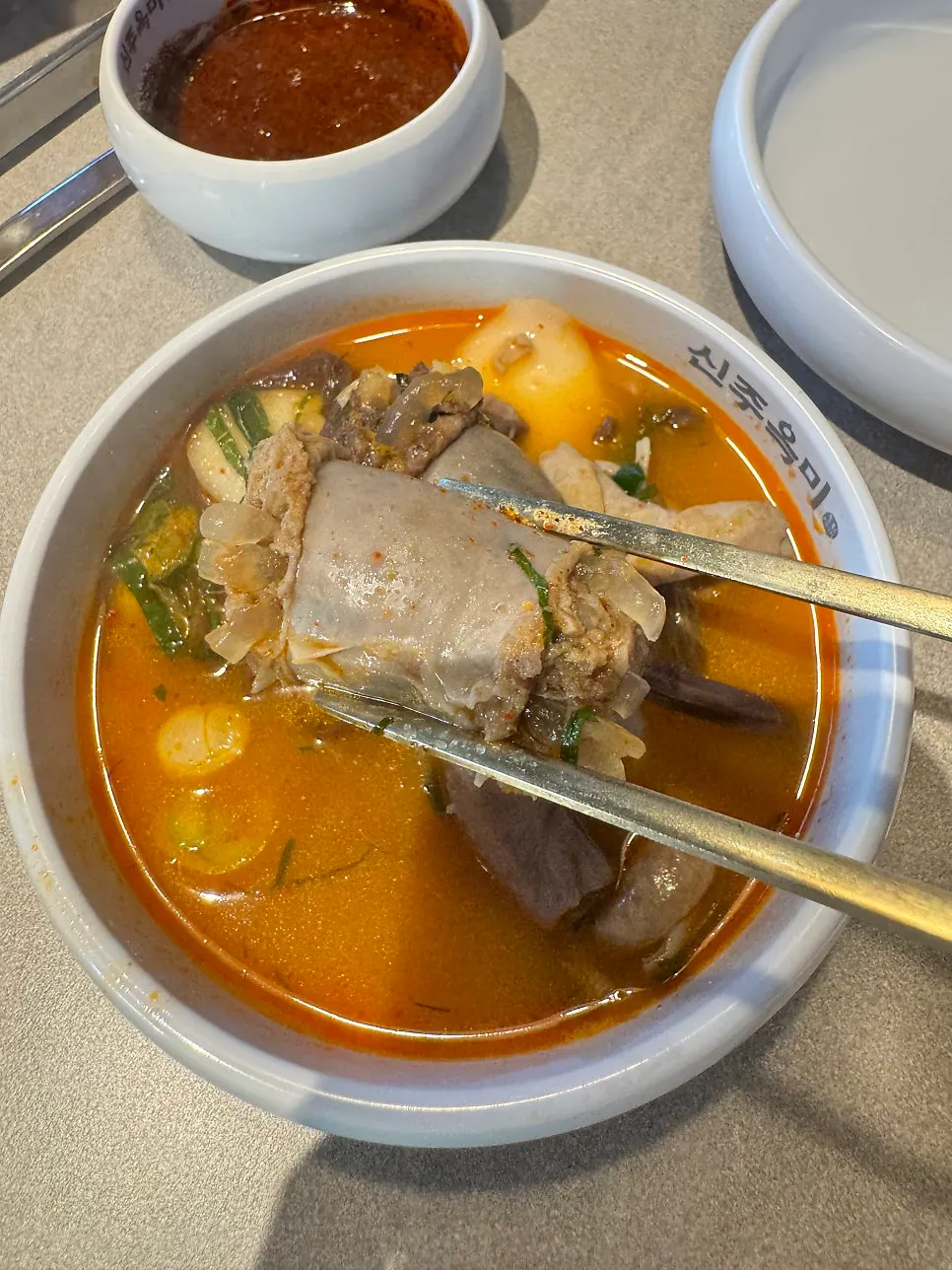 The spicy jeongol broth simmering and turning richer