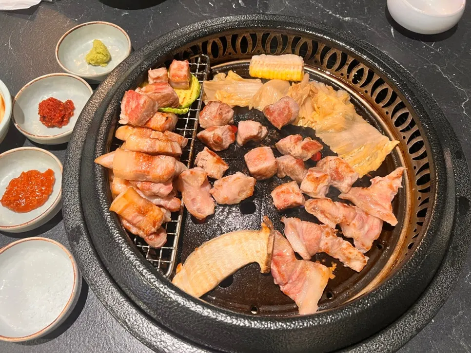 Assorted meat placed on the grill