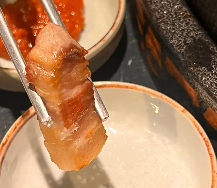 Meat turning golden on the grill
