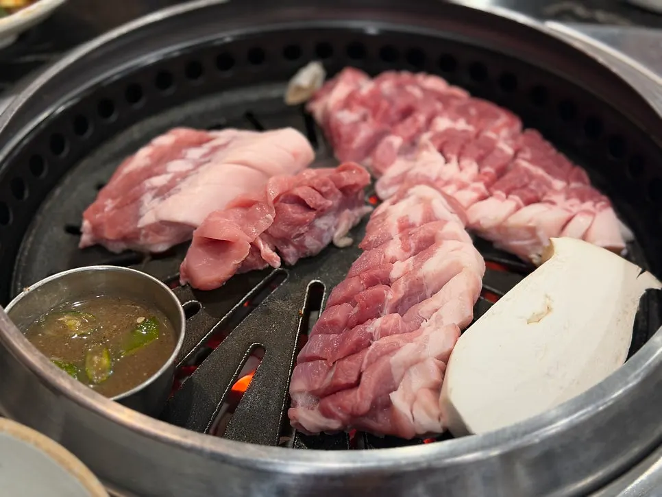 Raw Jeju black pork with score marks cut into it