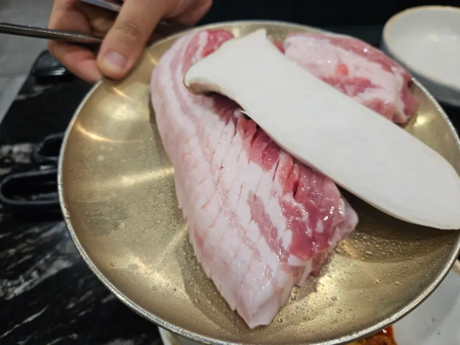 Two thick servings of Jeju black pork belly