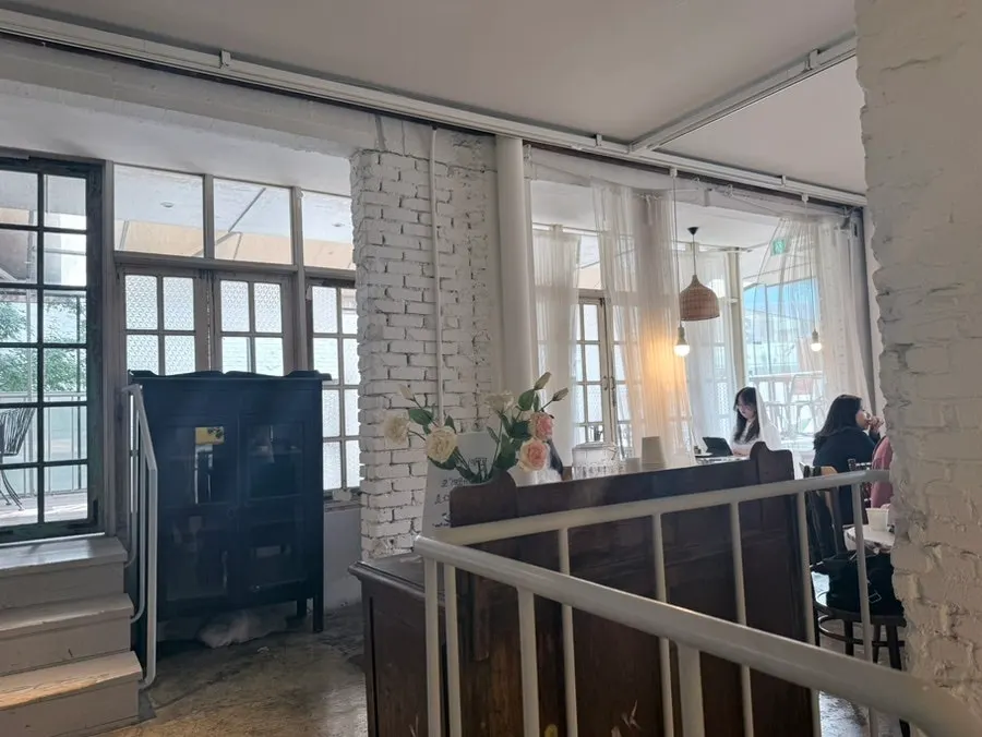 Spacious hall seating at Something About Coffee