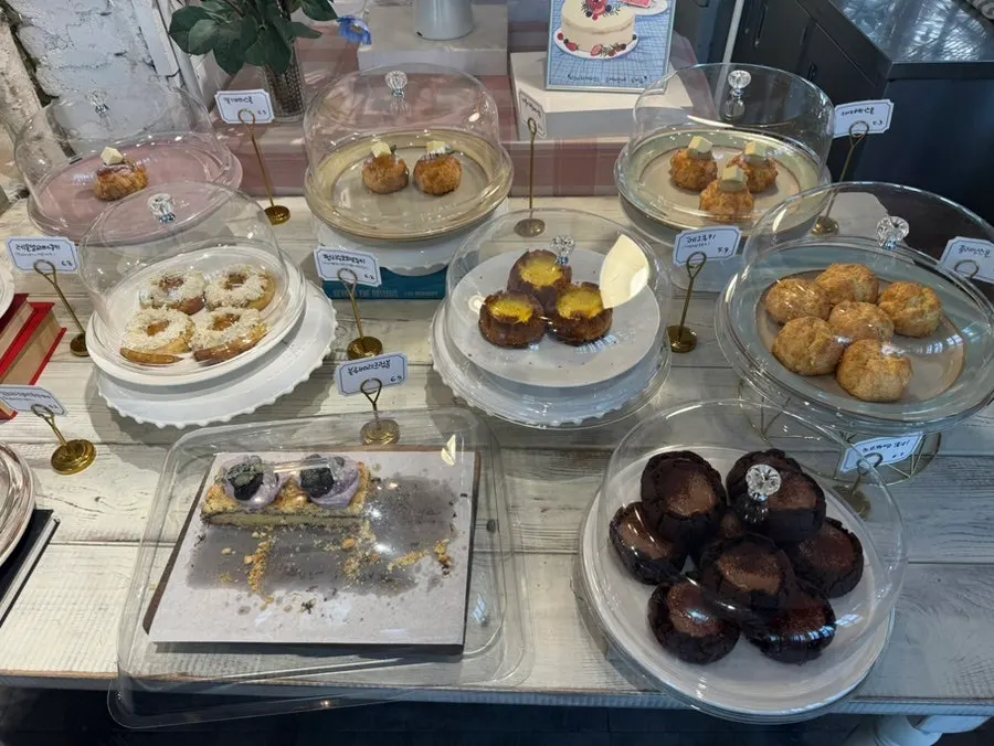 Egg tarts and baked pastries on display