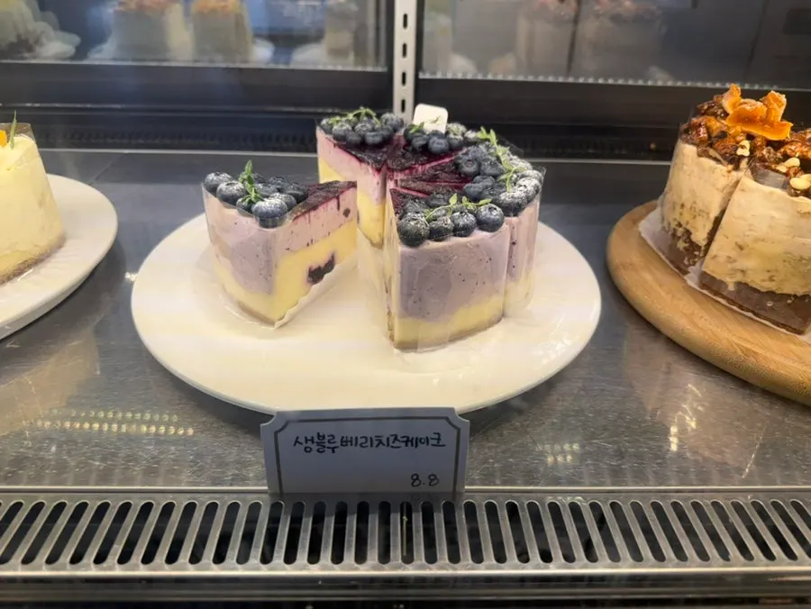 Cheesecake display case at Something About Coffee
