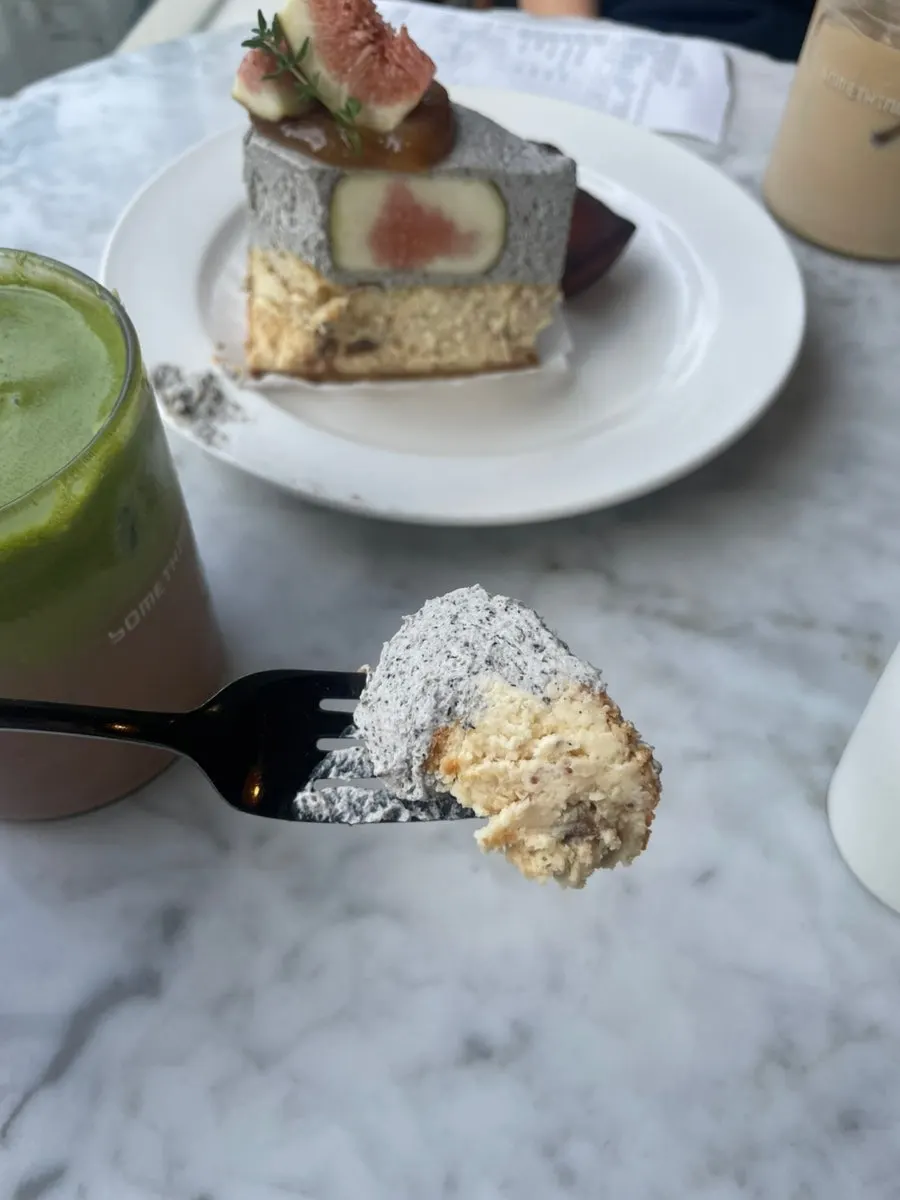Black sesame fig cheesecake cut with a fork