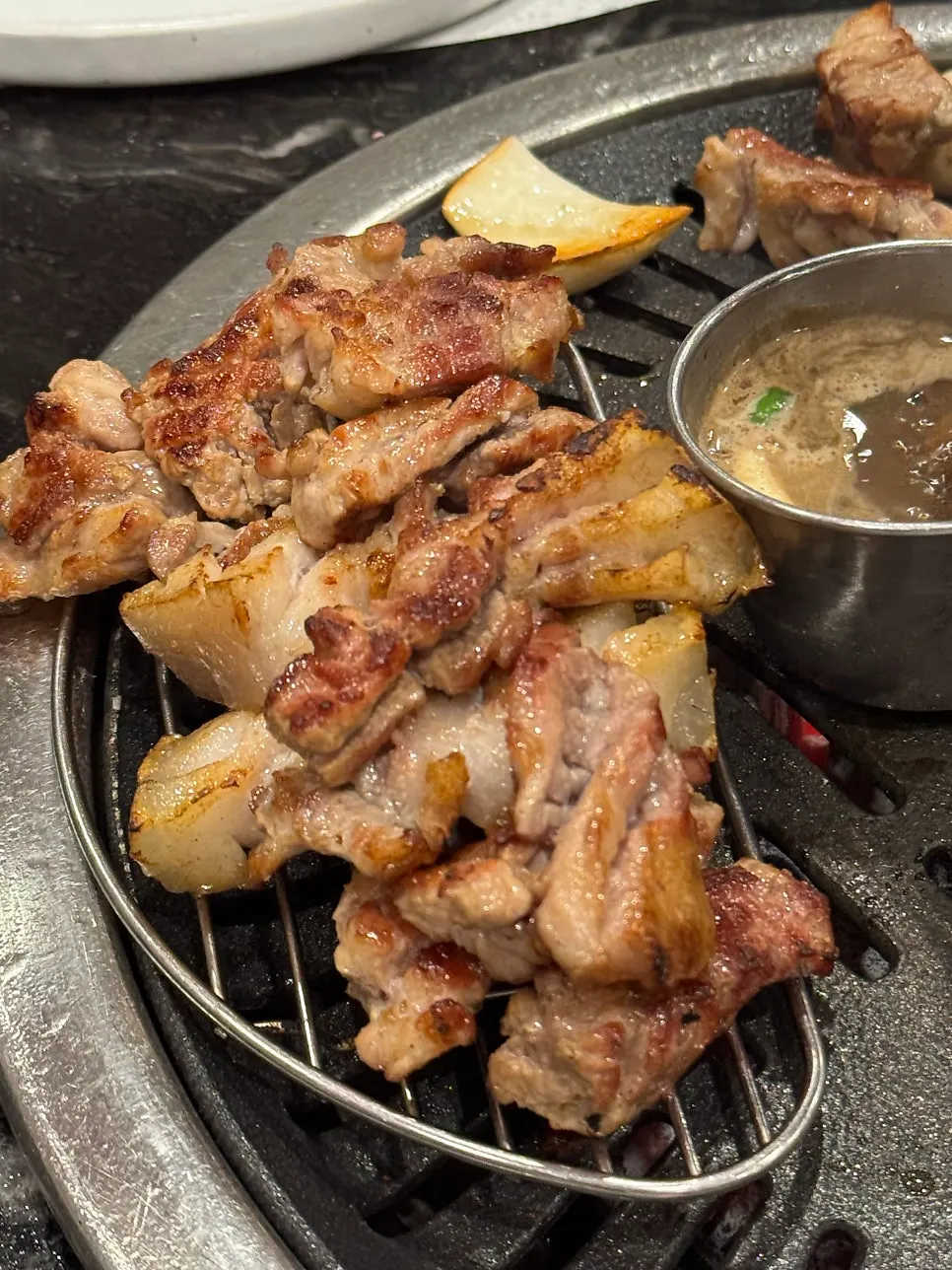 Pork belly and pork neck grilled and stacked by staff