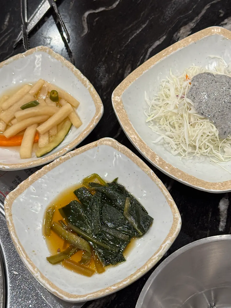 Meat table setting with vegetables and side dishes