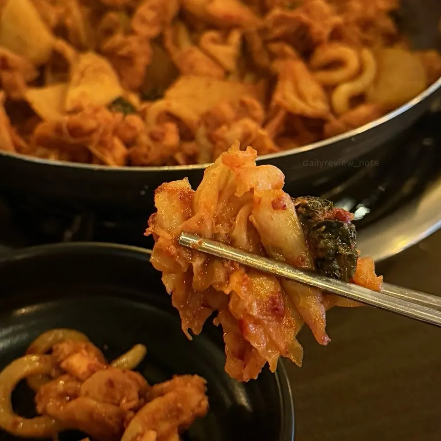 Seasoned dakgalbi with cabbage and perilla leaves
