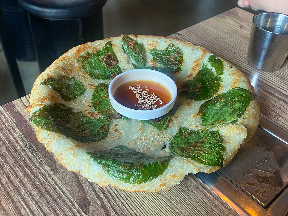 Table set with dakgalbi and potato pancake