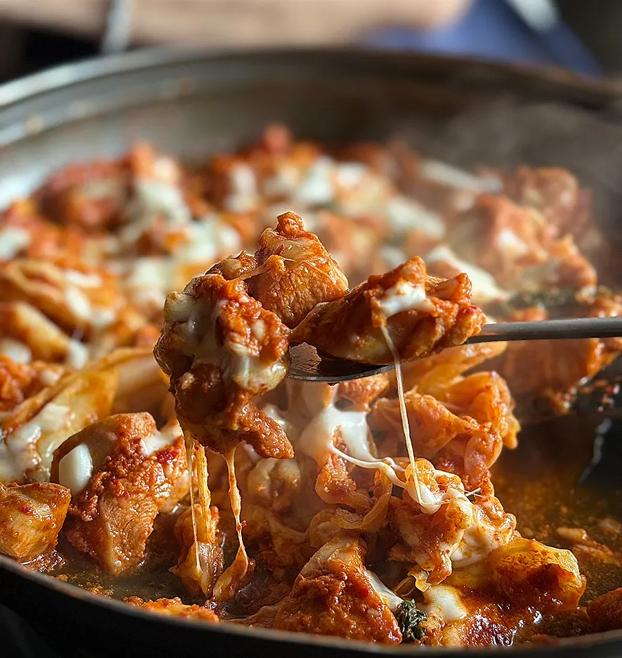 Dakgalbi wrapped in stretchy melted cheese