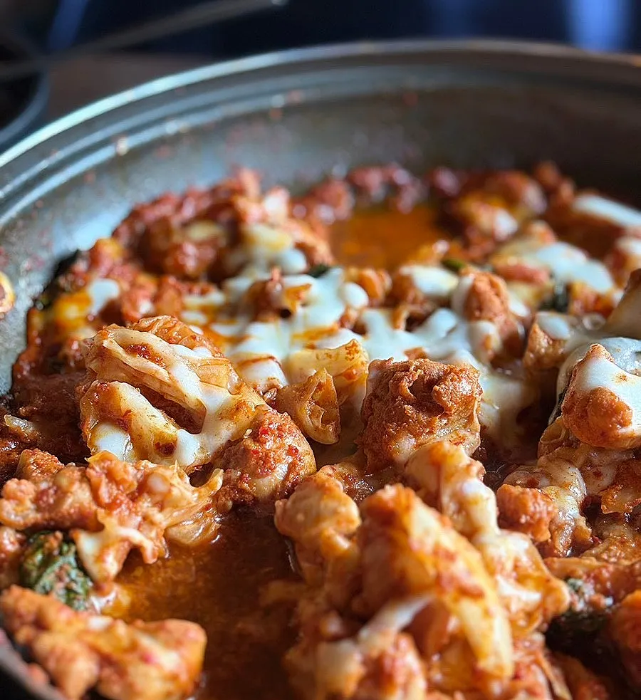 Dakgalbi with cabbage and perilla leaves