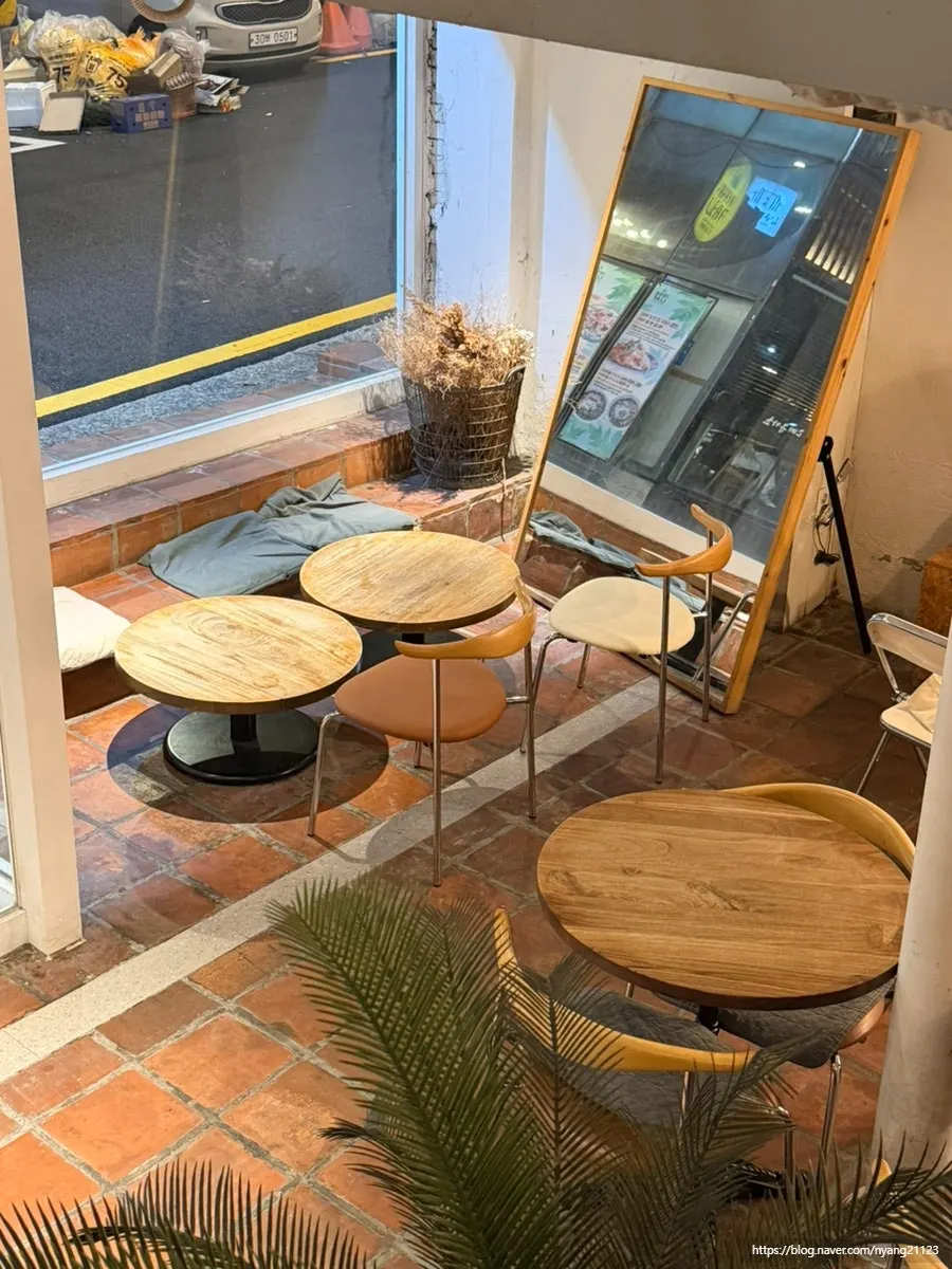 First-floor seating with a full-length mirror
