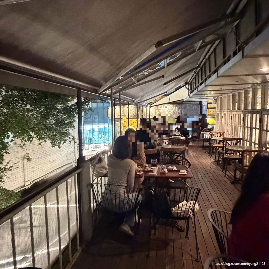 Spacious terrace seating with a nighttime atmosphere