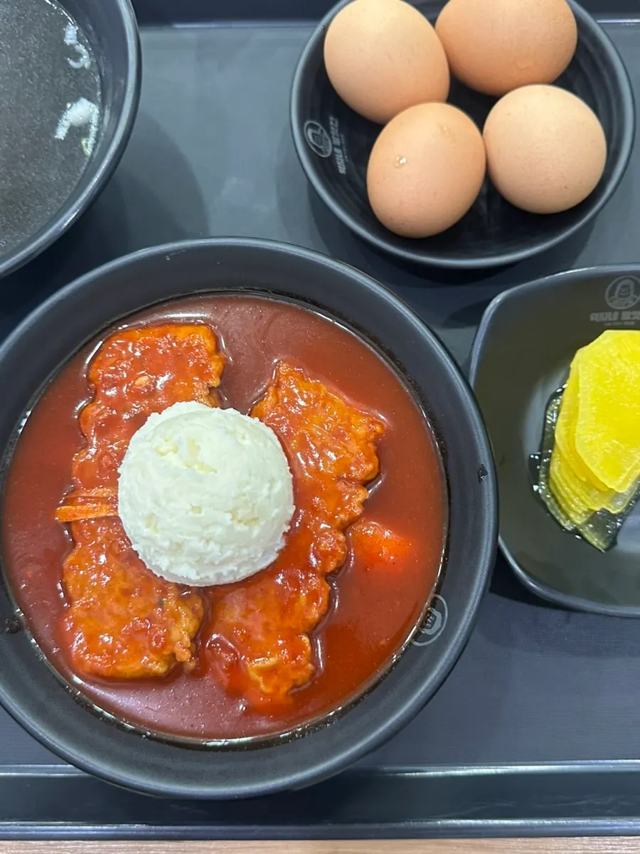 Self-serve bar with pickled radish and utensils