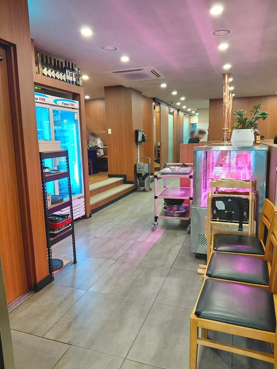 Waiting area at the entrance and meat display fridge