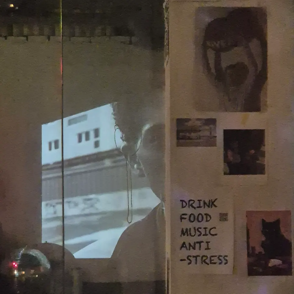 Photo related to the dark, cozy venue atmosphere