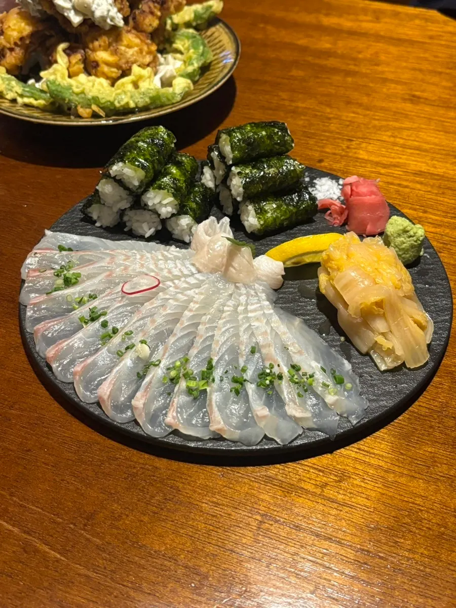 Sio sanhap plate with flounder sashimi and gimbap together