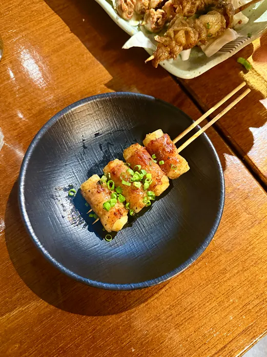 Yakitori skewer dipped in mayonnaise